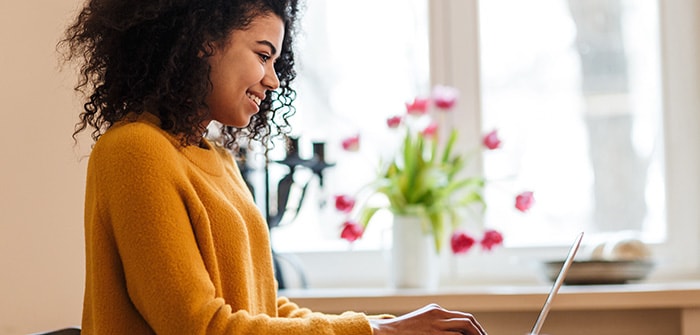 Decorative image: woman typing on a laptop