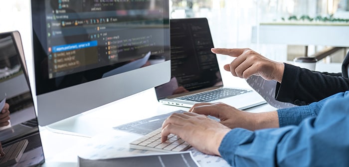 App developer typing on a keyboard